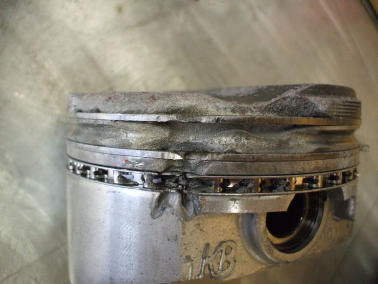 Piston blown by preignition due to low quality motor oil
